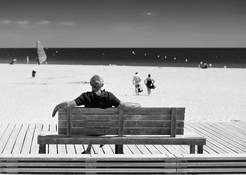 Man on a beach bench, France
